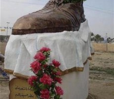 A statue built for Iraqi journalist Muntazer al-Zaidi, who hurled his shoes at former U.S. president George Bush, is seen in Tikrit
